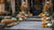 A front porch decorated by Gourd Greetings with approximately 80  pumpkins and gourds arranged on the steps and along the walkway at a Pittsburgh estate — Gourd Greetings luxury fall décor